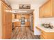 Functional kitchen featuring wood cabinetry, stainless steel appliances, and ample counter space for meal preparation at 3003 Tamarind Dr, Edgewater, FL 32141