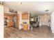 Open kitchen with wood cabinets, stainless steel appliances, and a seamless flow into the living and entryway at 3003 Tamarind Dr, Edgewater, FL 32141