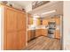 Updated kitchen with wooden cabinets, stainless steel appliances, and plenty of counter space for cooking and entertaining at 3003 Tamarind Dr, Edgewater, FL 32141