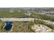 A scenic aerial view showcasing the community, with lush greenery, serene lakes, and beautifully designed homes nestled in nature at 301 Sunset Point Dr, Ormond Beach, FL 32174