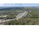 Scenic aerial view of a community by the water, blending residential living with natural surroundings at 301 Sunset Point Dr, Ormond Beach, FL 32174