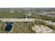 A scenic aerial view showcasing the community, with lush greenery, serene lakes, and beautifully designed homes nestled in nature at 301 Sunset Point Dr, Ormond Beach, FL 32174