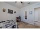 Cozy bedroom with neutral carpet and walls, featuring a closet with mirrored doors at 301 Sunset Point Dr, Ormond Beach, FL 32174