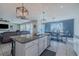 Spacious kitchen with granite island, stainless appliances, and adjacent dining area with ample natural light at 301 Sunset Point Dr, Ormond Beach, FL 32174