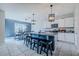 Modern kitchen featuring a center island with granite countertops, barstool seating, and stainless steel appliances at 301 Sunset Point Dr, Ormond Beach, FL 32174