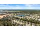 Aerial view of the community highlighting the home's proximity to community pond and surrounding landscape at 3029 Adrian Dr, Ormond Beach, FL 32174