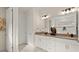 Bathroom featuring double vanity, marble floors, and updated fixtures at 3029 Adrian Dr, Ormond Beach, FL 32174