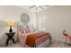 Cozy bedroom with colorful patterned bedding, and light wood flooring at 3029 Adrian Dr, Ormond Beach, FL 32174