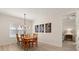 Dining room with wooden table and chairs with window and artwork at 3029 Adrian Dr, Ormond Beach, FL 32174