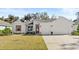 Charming single-story home with a well-manicured lawn and inviting front entrance at 3029 Adrian Dr, Ormond Beach, FL 32174