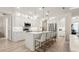 Modern kitchen featuring white cabinets, stainless steel appliances, and an island with seating at 3029 Adrian Dr, Ormond Beach, FL 32174
