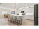Kitchen featuring a view into a large dining room and white cabinets with stainless steel appliances at 3029 Adrian Dr, Ormond Beach, FL 32174