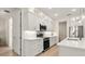 Bright kitchen featuring stainless steel appliances, white cabinetry, and hardwood flooring at 3029 Adrian Dr, Ormond Beach, FL 32174