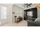 Sitting room featuring hardwood floors, a mini bar, modern ceiling fan, and leather seating at 3029 Adrian Dr, Ormond Beach, FL 32174
