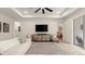 Living room with a modern ceiling fan, oversized couch, neutral color palette, and plenty of natural light at 3029 Adrian Dr, Ormond Beach, FL 32174