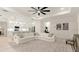 Open floor plan with a large sectional sofa, bright lighting, and access to the kitchen at 3029 Adrian Dr, Ormond Beach, FL 32174