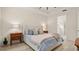 Main bedroom features light wood flooring, neutral walls, and a view to the adjacent bathroom at 3029 Adrian Dr, Ormond Beach, FL 32174