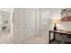 Office space with a dark desk, a window, and a sliding closet at 3029 Adrian Dr, Ormond Beach, FL 32174