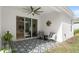Covered patio with stylish furniture, ideal for outdoor relaxation and entertaining at 3029 Adrian Dr, Ormond Beach, FL 32174