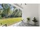 Covered patio features patterned flooring and overlooks a beautiful, expansive yard at 3029 Adrian Dr, Ormond Beach, FL 32174