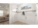 Bright shower with glass doors and tiled walls and a view to the bedroom at 3029 Adrian Dr, Ormond Beach, FL 32174