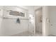 Shower with glass doors and tiled walls at 3029 Adrian Dr, Ormond Beach, FL 32174