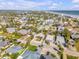 Residential neighborhood with colorful homes, lush landscaping, and proximity to the beach at 308 Normandy Ave, New Smyrna Beach, FL 32169