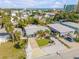 Bright, single-story home with a well-manicured lawn, driveway, tropical landscaping, and proximity to the beach at 308 Normandy Ave, New Smyrna Beach, FL 32169