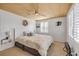 This bedroom features wood ceilings, blinds and a ceiling fan at 308 Normandy Ave, New Smyrna Beach, FL 32169