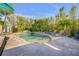 Inviting pool and spa surrounded by lush greenery and lounge chairs at 308 Normandy Ave, New Smyrna Beach, FL 32169