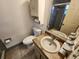 Cozy bathroom with sink, toilet, and shower/tub combo with tile surround at 309 & 311 Sea Hawk Ct, Edgewater, FL 32141