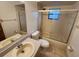 Standard bathroom with a single sink vanity, toilet, and shower/tub combo at 309 & 311 Sea Hawk Ct, Edgewater, FL 32141