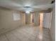 Neutral bedroom with tiled floors, ample natural light, and ceiling fan at 309 & 311 Sea Hawk Ct, Edgewater, FL 32141