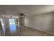 Open-concept living room with tile flooring and seamless access to the outdoors at 309 & 311 Sea Hawk Ct, Edgewater, FL 32141
