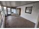 Enclosed sunroom with sliding glass doors and windows, offering an additional living space at 309 & 311 Sea Hawk Ct, Edgewater, FL 32141