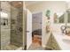 Beautiful bathroom featuring a tiled shower and double sink vanity leading to the main bedroom at 3456 Pegaso Ave, New Smyrna Beach, FL 32168