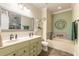 Bright bathroom with double vanity, soaking tub, and stylish tile accents at 3456 Pegaso Ave, New Smyrna Beach, FL 32168