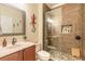 Modern bathroom featuring a glass-enclosed shower with pebble flooring and updated vanity at 3456 Pegaso Ave, New Smyrna Beach, FL 32168
