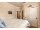 Bright bedroom with a ceiling fan, closet, and easy access to other areas of the home at 3456 Pegaso Ave, New Smyrna Beach, FL 32168