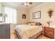Cozy bedroom with wood floors, a ceiling fan, and ample natural light at 3456 Pegaso Ave, New Smyrna Beach, FL 32168