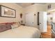 Comfortable bedroom featuring hardwood floors, crown moulding, and a double closet at 3456 Pegaso Ave, New Smyrna Beach, FL 32168