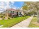 Beautiful one-story home with a terra cotta tile roof and lush landscaping at 3456 Pegaso Ave, New Smyrna Beach, FL 32168
