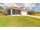 Well-maintained single story home features a two car garage, mature landscaping, and a screened in porch at 3456 Pegaso Ave, New Smyrna Beach, FL 32168