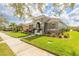 Charming single-story home featuring a well-manicured lawn and welcoming entrance at 3456 Pegaso Ave, New Smyrna Beach, FL 32168