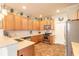 Well-equipped kitchen with stainless steel appliances, stylish tile backsplash, and ample cabinet space at 3456 Pegaso Ave, New Smyrna Beach, FL 32168