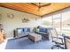 Screened in lanai provides extra space for seating and relaxation under a beautiful wood ceiling at 3456 Pegaso Ave, New Smyrna Beach, FL 32168