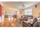 Spacious living room with hardwood floors, stylish seating, and lots of natural light at 3456 Pegaso Ave, New Smyrna Beach, FL 32168