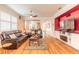 Comfortable living room featuring modern decor, hardwood flooring, and an open layout at 3456 Pegaso Ave, New Smyrna Beach, FL 32168