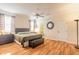 Spacious main bedroom with hardwood floors, large windows, and a ceiling fan at 3456 Pegaso Ave, New Smyrna Beach, FL 32168