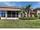 Well maintained backyard featuring lush green lawn and tropical landscaping, enhancing the outdoor appeal at 3546 Casalta Cir, New Smyrna Beach, FL 32168